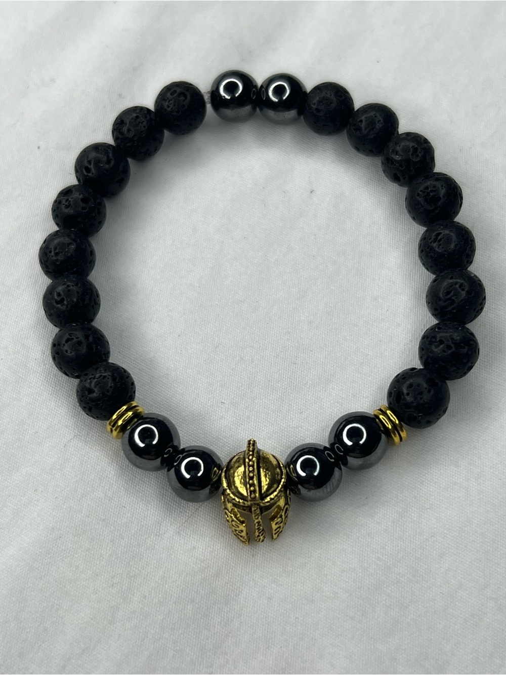 Men's Black Lava & Hematite Bracelet with Gold Helmet Accent